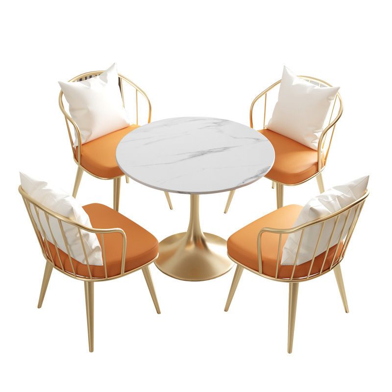 Salle de salle à manger blanche en pierre glamour avec table ronde et meubles de table à manger de base en métal