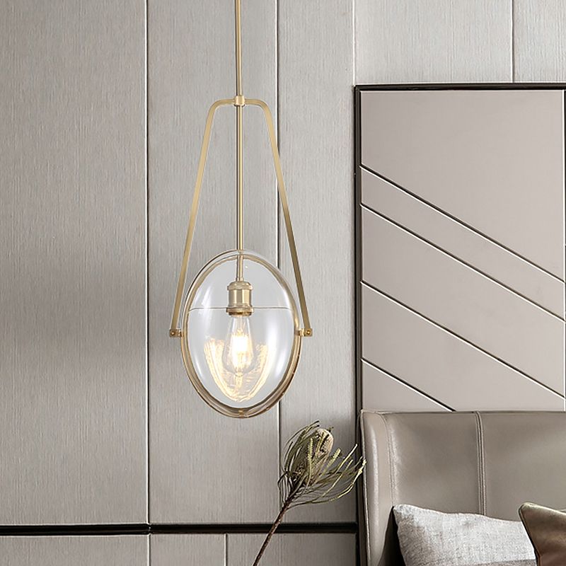 Brass Oval Pendant Light Contemporary 1-Light Clear Glass Ceiling Lamp with Forked Halberd Frame