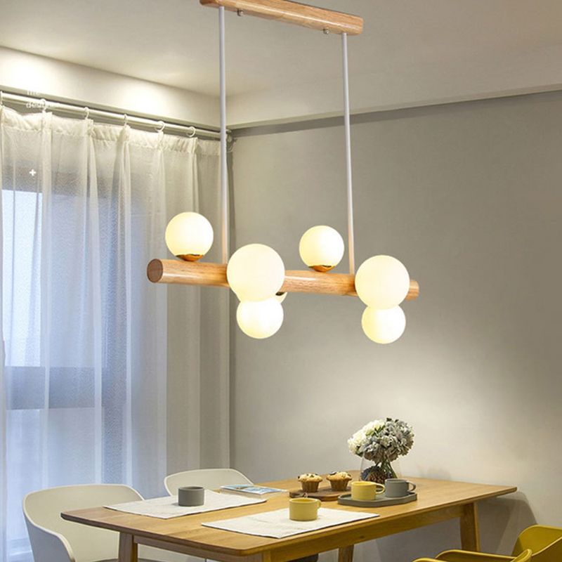 Luces colgantes de restaurantes de múltiples cabezas de madera moderna con sombra de vidrio de globo
