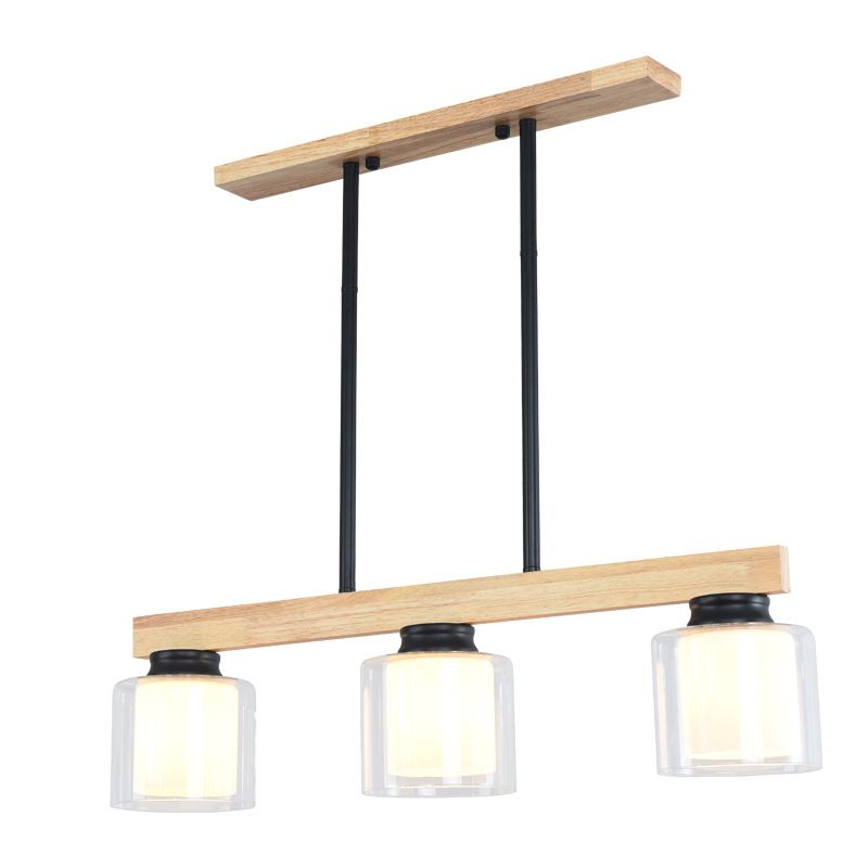 Ciondolo a isola moderna nordica con lampada da pranzo cilindrica in vetro del paralume.