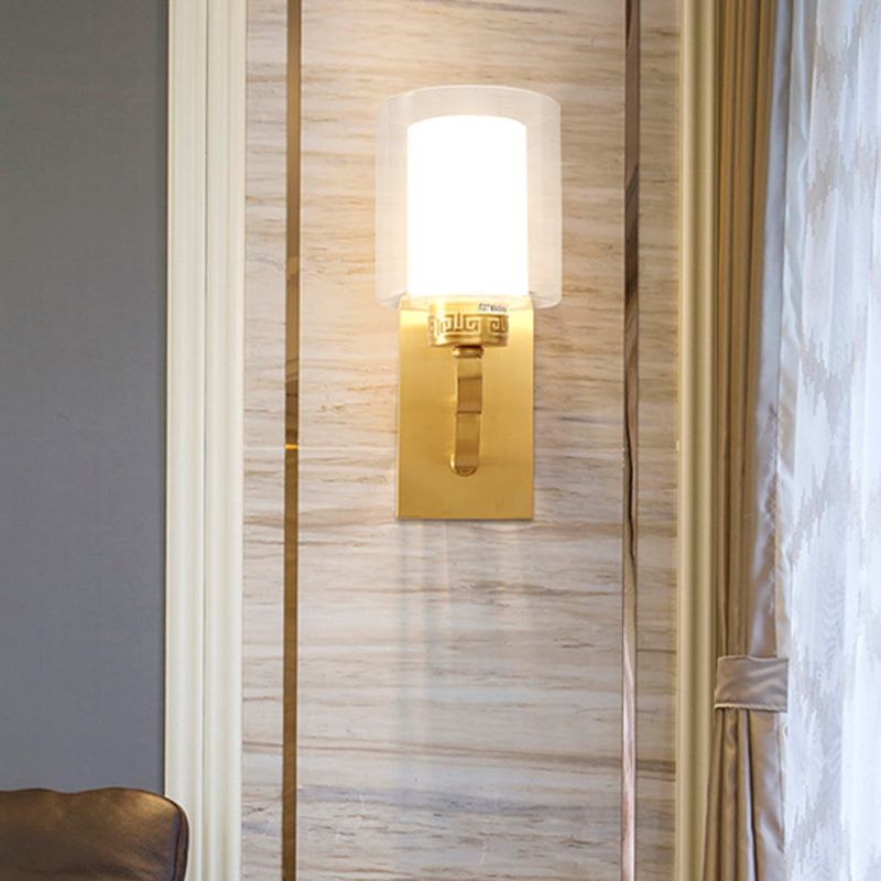 1 Kopfwandbeleuchtung mit Zylinderschatten klar und weißes Glas moderne Schlafzimmer Wandleuchte im Messing