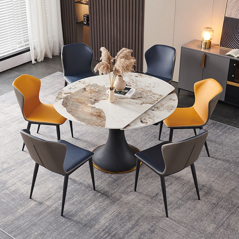 Mesa de comedor de piedra sinterizada de lujo con base de metal negro
