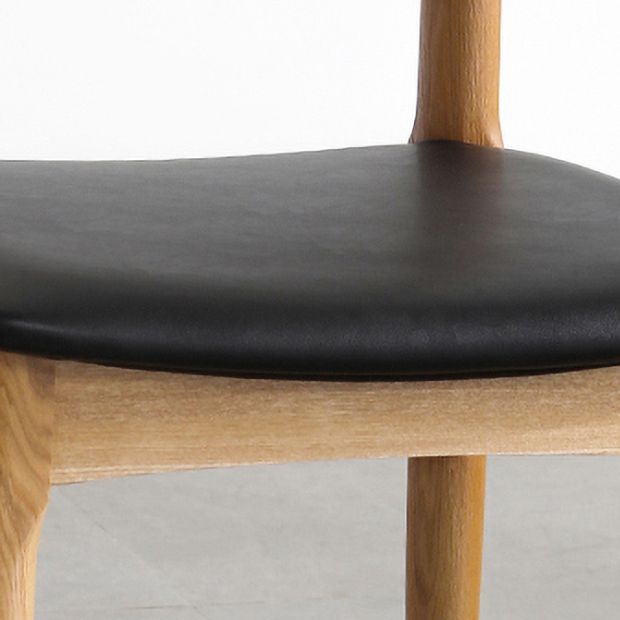 Silla lateral escandinava con respaldo abierto Silla de comedor tapizada con acabado mate