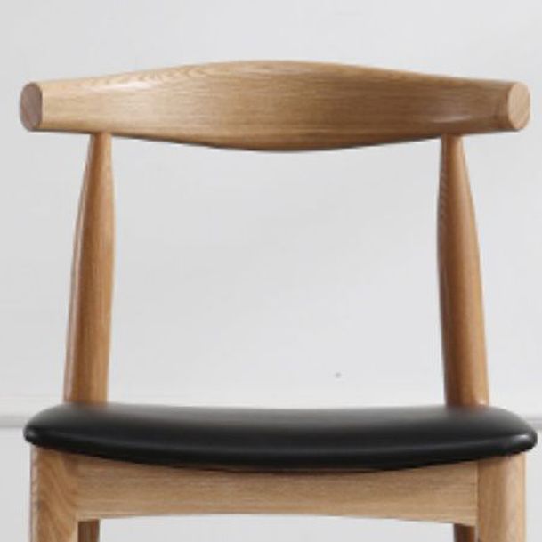 Silla lateral escandinava con respaldo abierto Silla de comedor tapizada con acabado mate