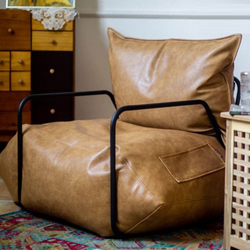 Contemporary Armchair Pillow Back Round Arms with Black Legs Leather Arm Chair