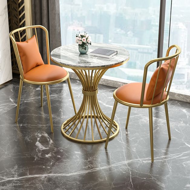 Juego de comedor de cocina glamorosa con top de piedra sinterizado y muebles de comedor de base de metal