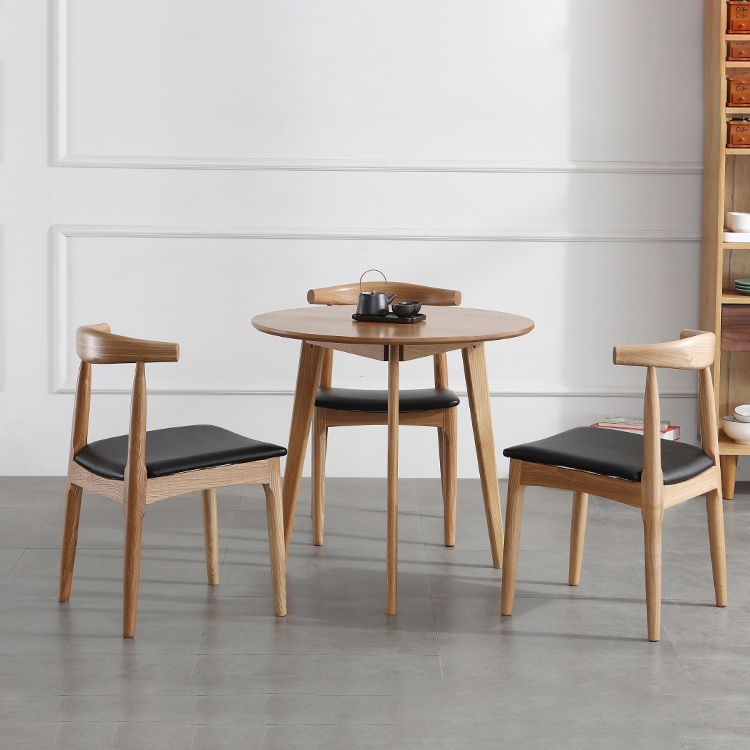 Silla lateral escandinava con respaldo abierto Silla de comedor tapizada con acabado mate
