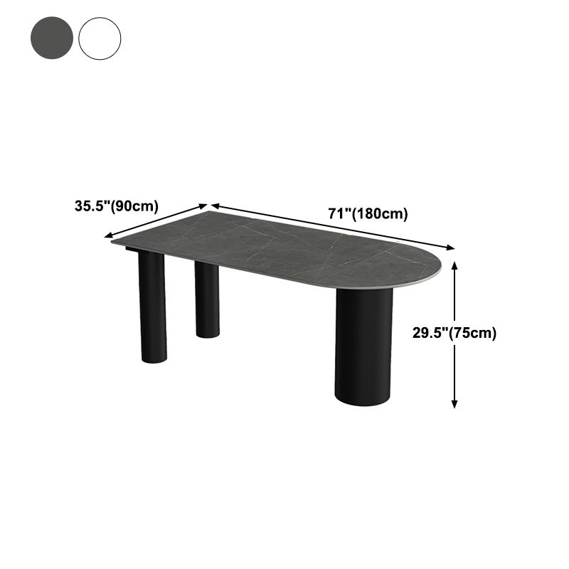 Tavolo da pranzo moderno con piano in pietra e base in acciaio nero