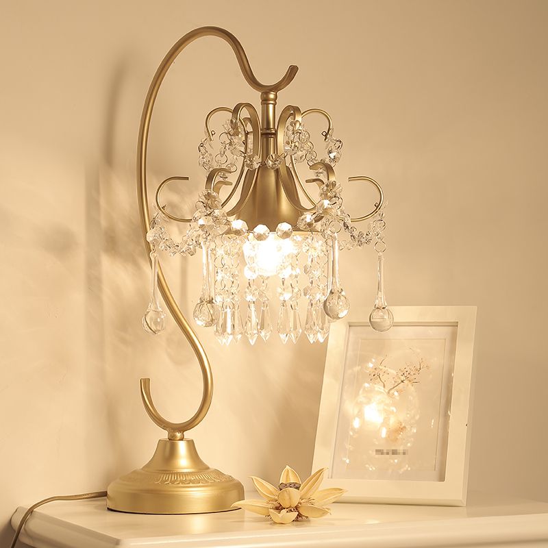 1 lampe de table à dos de bras plié la tête