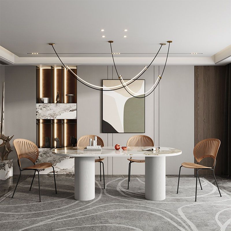 Table de salle à manger ovale moderne avec dessus en pierre et double piédestal en métal
