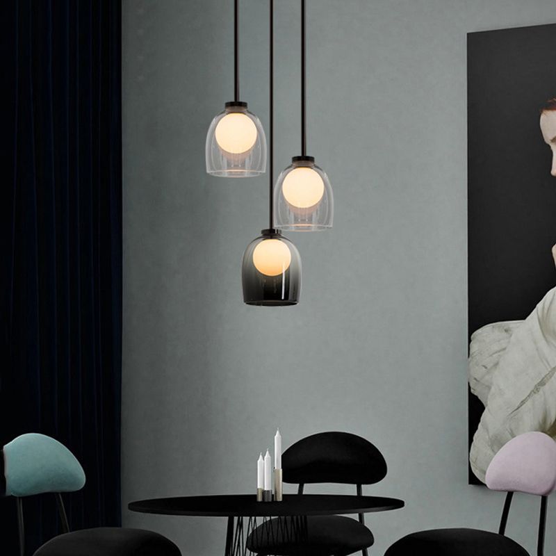 Lampe suspendue à la cloche en verre dans un pendentif en fer forgé moderne pour chambre à coucher