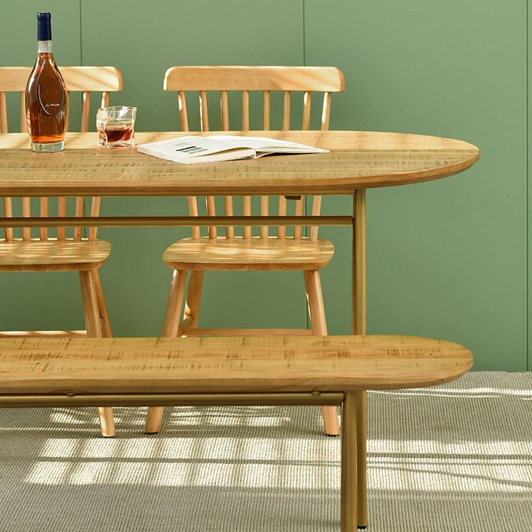 Zeitgenössischer Esstisch ovaler masser Holztisch mit metallischem vierbeinigen Tisch