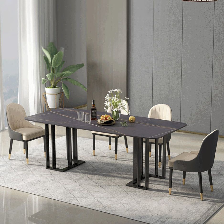 Set di sala da pranzo nera moderna di pietra sinterizzata con tavolo rettangolo e set da pranzo a base di metallo