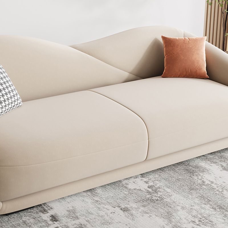 Contemporary Sloped Arm Curved Sofa Sewn Pillow Back Sofa for Living Room