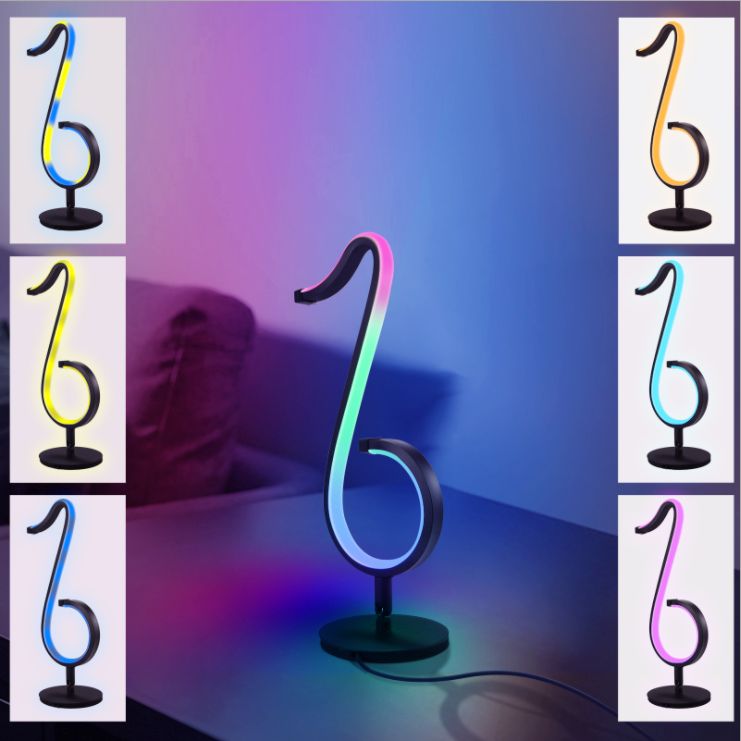 Lampada da tavolo a forma di nota musicale in metallo. Luce notturna a LED nera minimalista alla moda per camera da letto