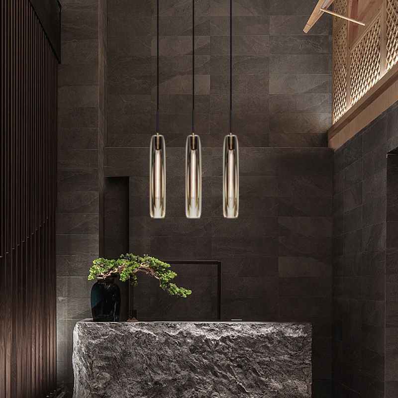 Lámpara colgante cilíndrica de cobre ligero de un solo colgante artístico moderno con sombra de cristal
