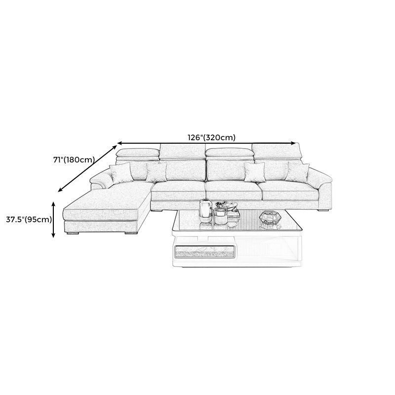 Divano a forma di L scandinava e cuscino da cuscino.