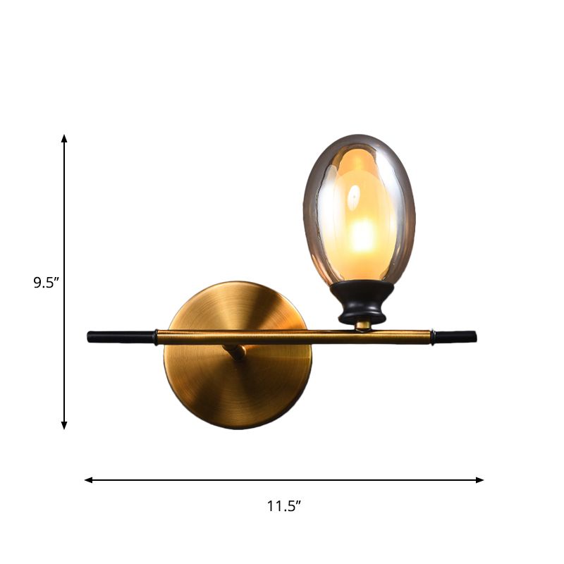 Clear/Amber Glass Egg Shape Wall Light Fixture Minimalist 1 Light Brass Sconce with Horizontal Arm