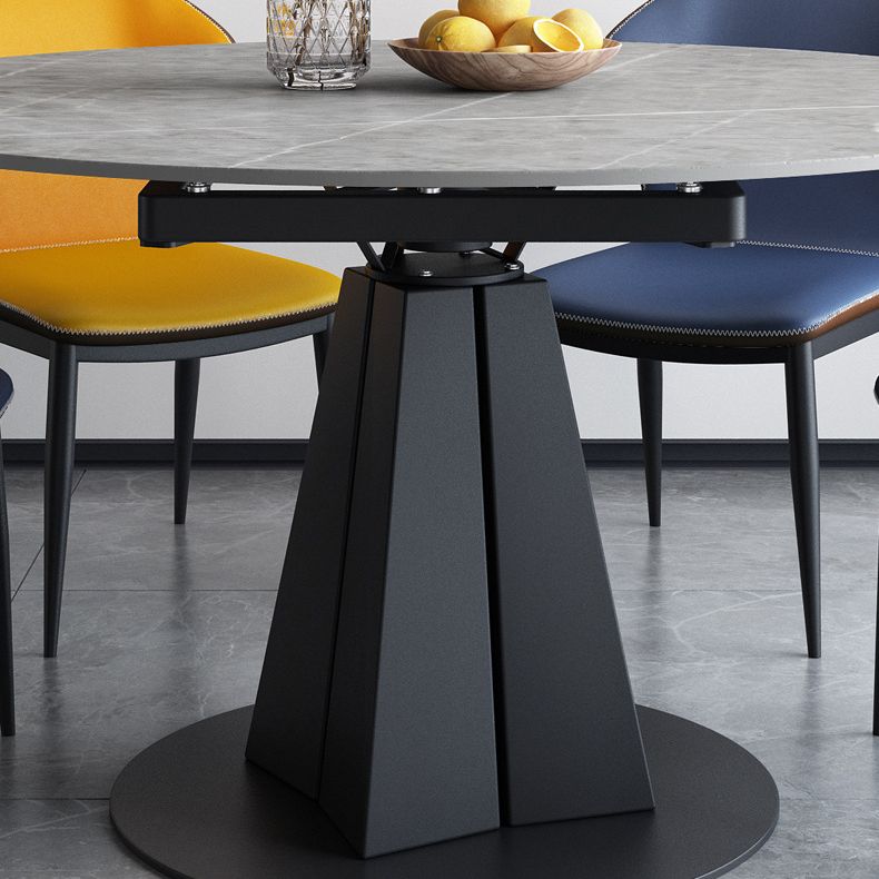 Table à manger en pierre fritrée de style moderne avec piédestal