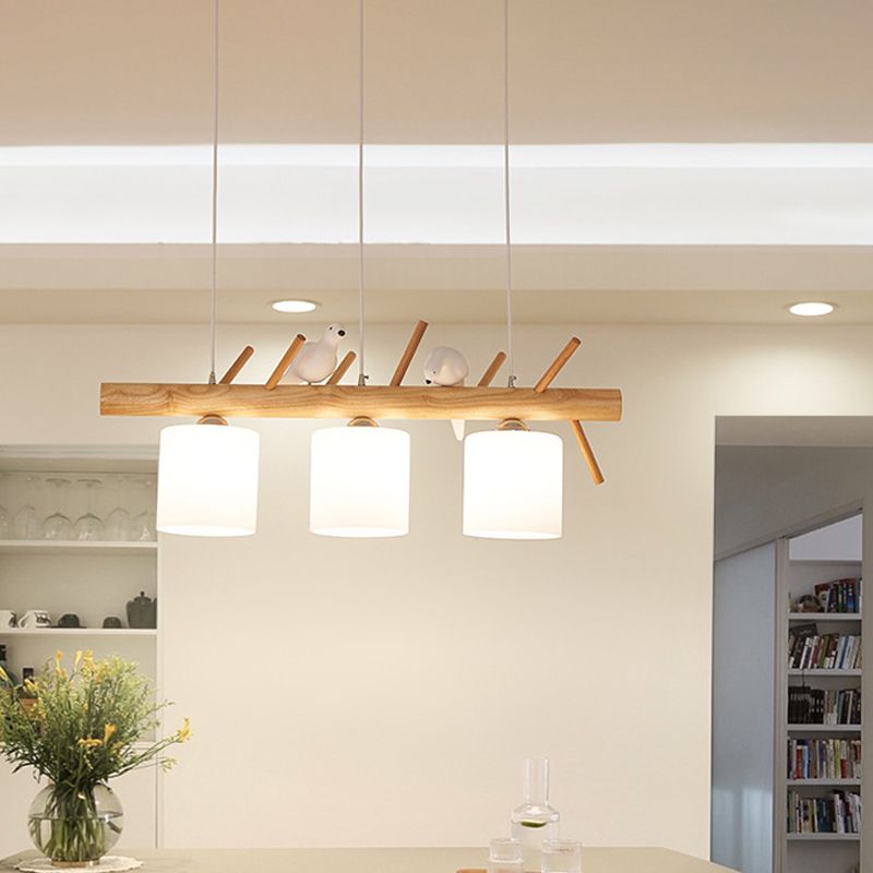 Beige Drum Island Lighting Ideas Simple 2/3 Heads Opaque Glass Pendant Lamp with Bird on Wood Branch Beam Design