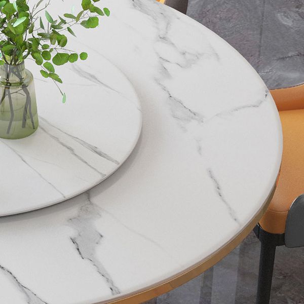 Tavolo da pranzo rotondo contemporaneo in metallo tavolo in pietra sinterizzata con base piedistallo