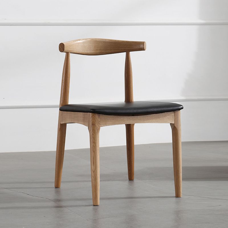 Silla lateral escandinava con respaldo abierto Silla de comedor tapizada con acabado mate