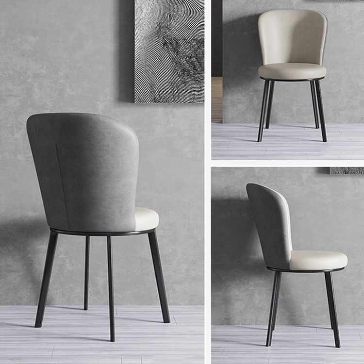 El lado contemporáneo del comedor preside la silla curvada de cuero mate de Parsons