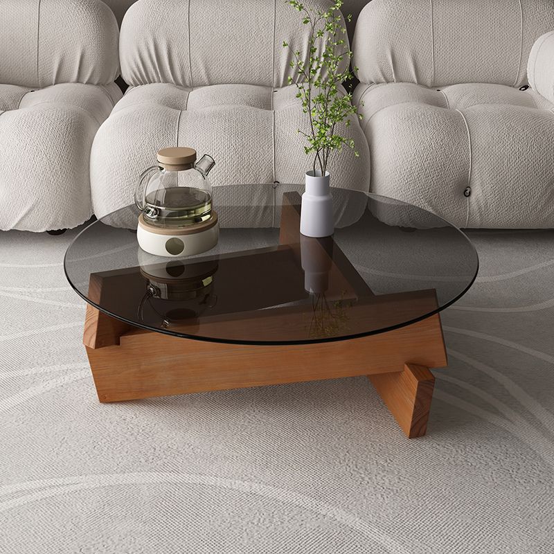 Modern Round Glass Top Coffee Table with Abstract Wooden Leg