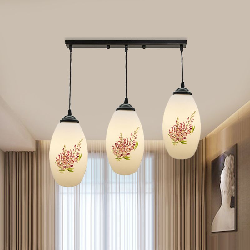 Minimalismus Ovaler Multi -Lampen -Anhänger 3 Köpfe Weiß gefrostete Glasfederung Licht in Schwarz mit linearem/rundem Baldachin