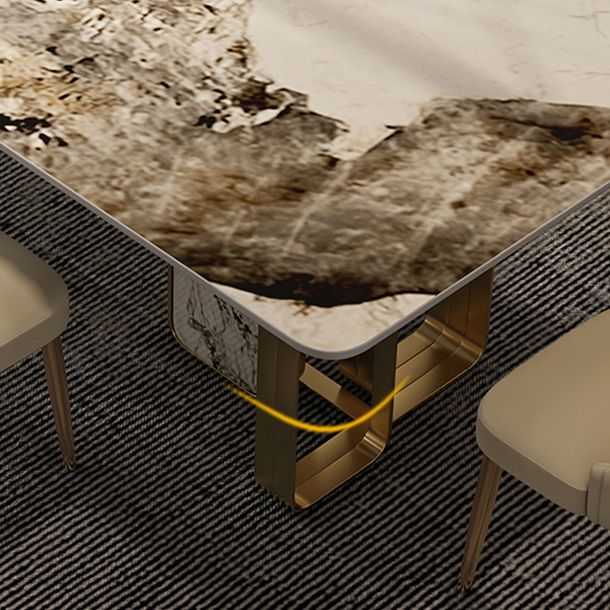 Mesa de comedor de piedra sinterizada de lujo con metal y piedra doble pedestal en oro