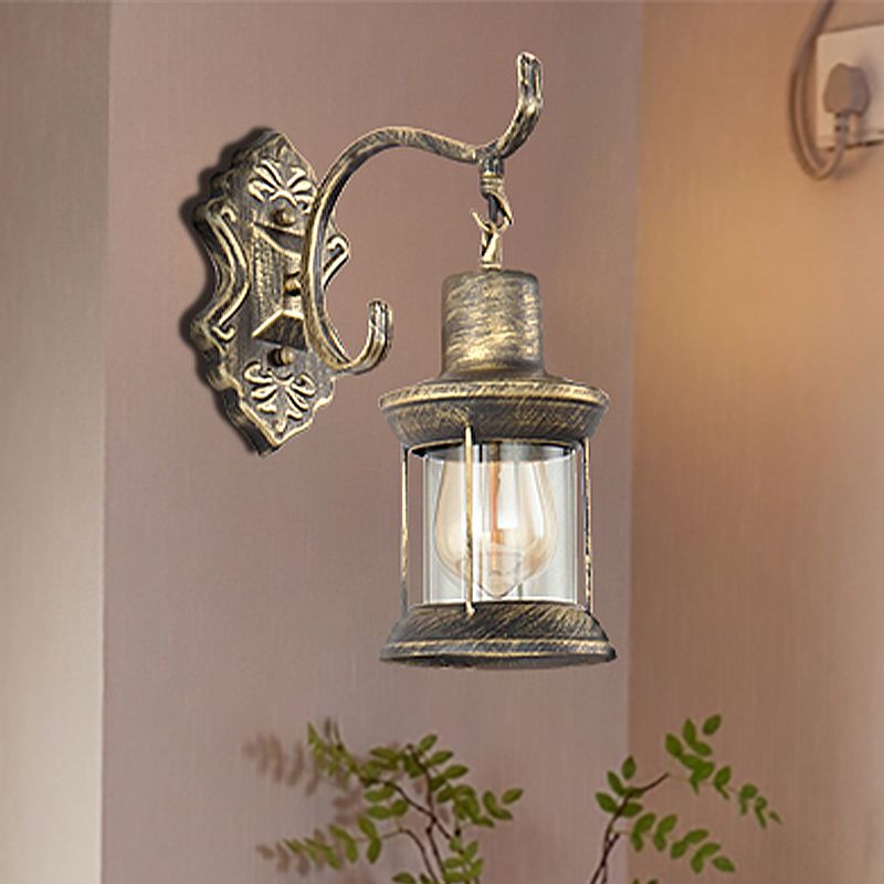 1 Bulb Kerosene Wall Mounted Light Fixture Rustic Style Aged Bronze Clear Glass Lighting with Carved Pattern