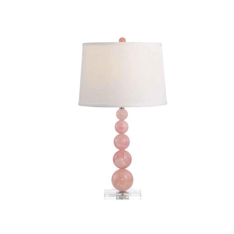 Lampada da comodino con paralume a botte Lampada da comodino bianca singola in tessuto modernista con supporto in vetro rosa con sfere