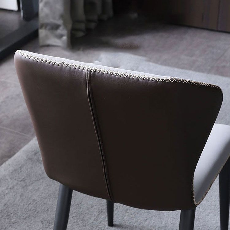 Silla lateral de cuero contemporánea para restaurante Sillas de comedor con respaldo orejero