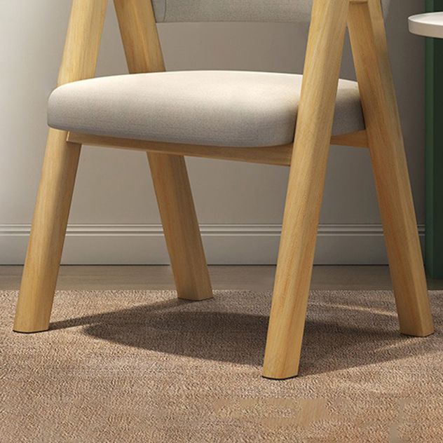 Silla de comedor moderna con respaldo abierto y acabado mate de sillón de tela para restaurante