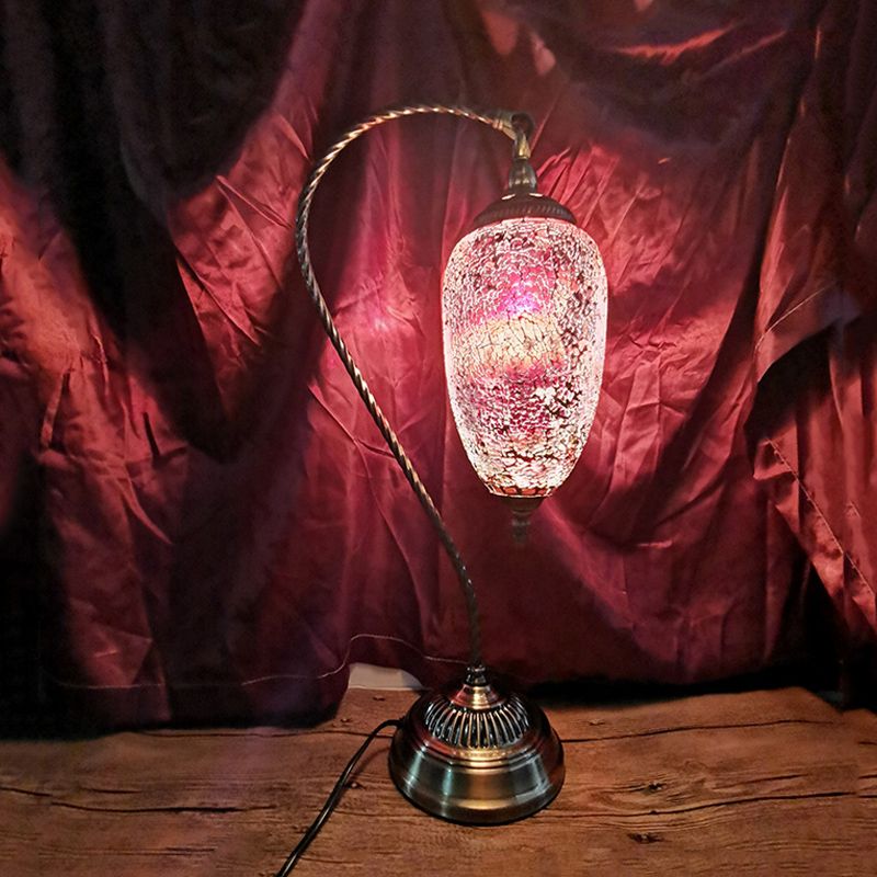 Lámpara de mesa de luz única, luz de vidrio elíptico de vidrio elíptico en bronce con brazo curvo