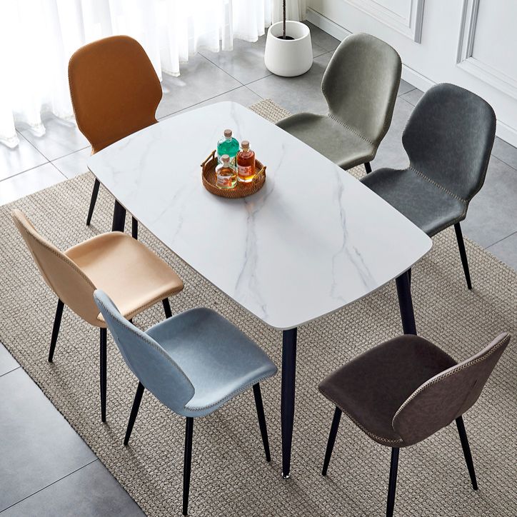 El comedor contemporáneo del metal preside el cuero sin brazos de la PU que cena las sillas