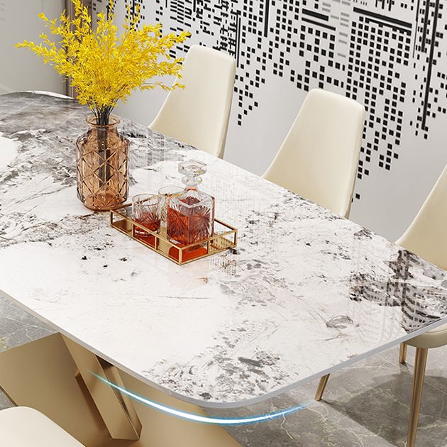 Mesa de comedor rectangular de lujo tradicional de metal, mesa superior de piedra sinterizada con base de pedestal