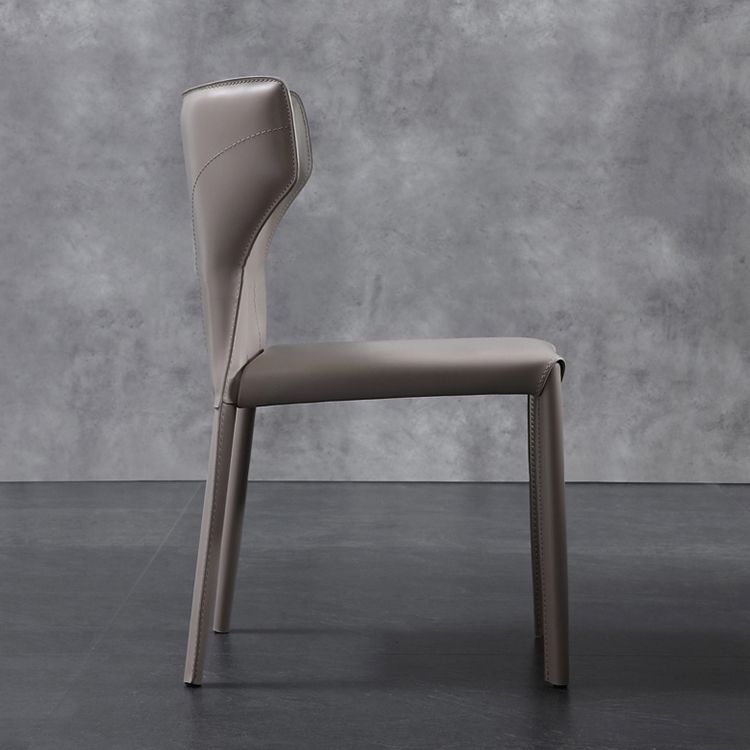 Silla lateral de comedor de cuero de estilo diseñador Silla de comedor Wingback para uso doméstico