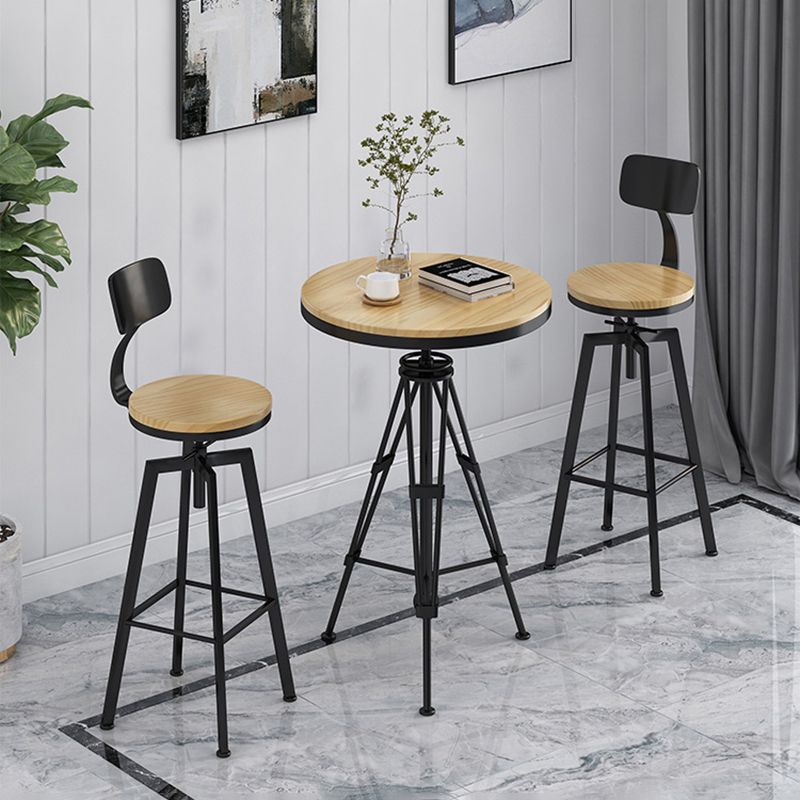 Industrielle höhenverstellbare schwarze Barhocker aus Eisen und Holz mit rundem Sitz