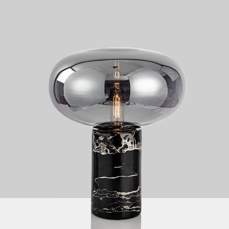 Lampada da tavolo da soggiorno ovale postmoderna in vetro grigio/ambra con 1 lampadina con base cilindrica in marmo nero