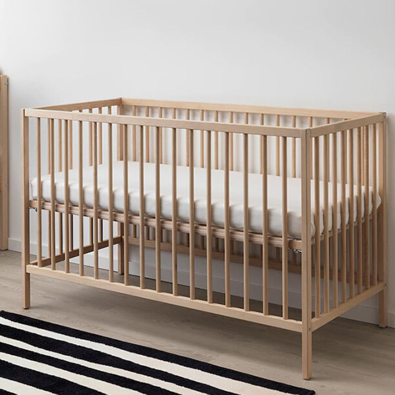 Traditional Nursery Crib with Adjustable Height in Natural Wood