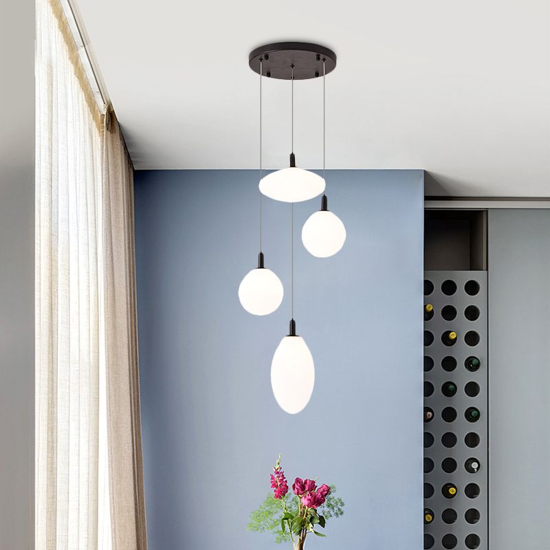 Gold/Black Ball and Oval Cluster Pendant Minimalism 4 Lights Cream Glass Hanging Lamp with Round Canopy