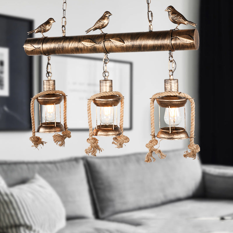 Coastal Lantern Island Pendant 3-Light Clear Glass Hanging Lamp Kit in Antique Brass with Bird