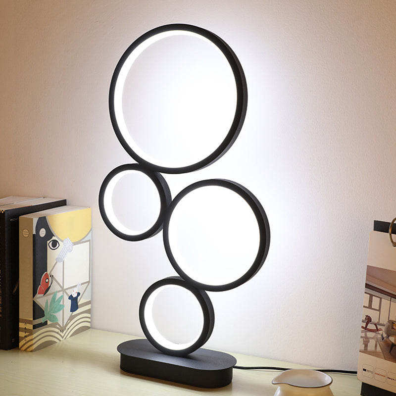 Lampada da tavolo rotonda semplice Implesatura Metallic LED Illuminazione notturna con piedistallo circolare in luce nera, calda/bianca