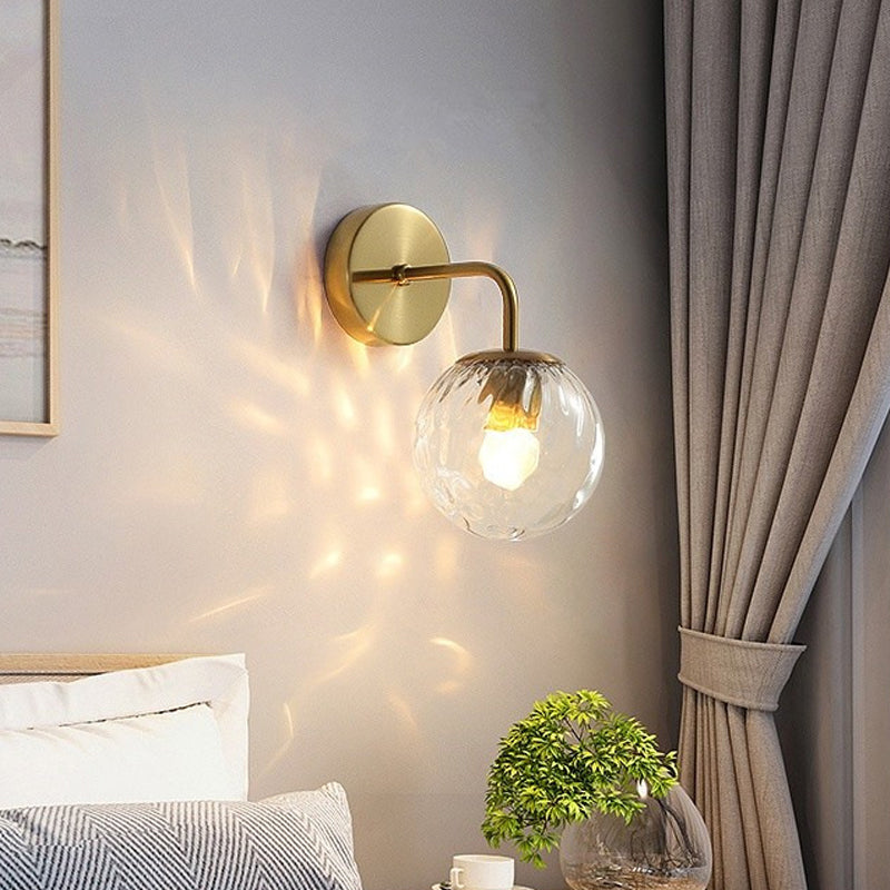Ball Shaped Wall Lamp Minimalist Clear Rippling Glass 1-Light Bedroom Wall Mounted Lighting with Bent Arm in Black/Gold