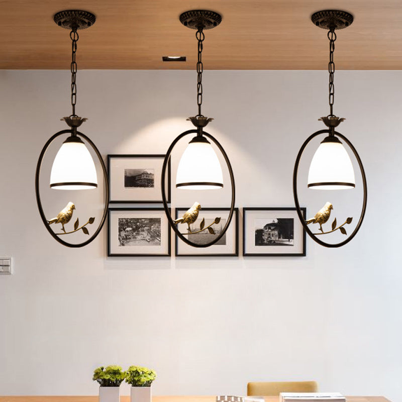 Rustic Oval/Round Pendulum Light 1 Bulb Metal Pendant Lamp in Black with Bell White Glass Shade and Bird Decoration