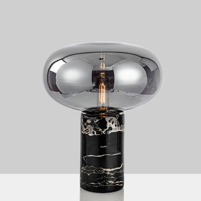 Lampada da tavolo da soggiorno ovale postmoderna in vetro grigio/ambra con 1 lampadina con base cilindrica in marmo nero
