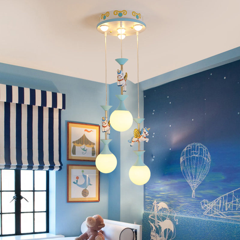 Cartoon Flying Unicorn Multi Light Pendant Resin Kindergarten Hanging Lighting with Sphere Cream Glass Shade