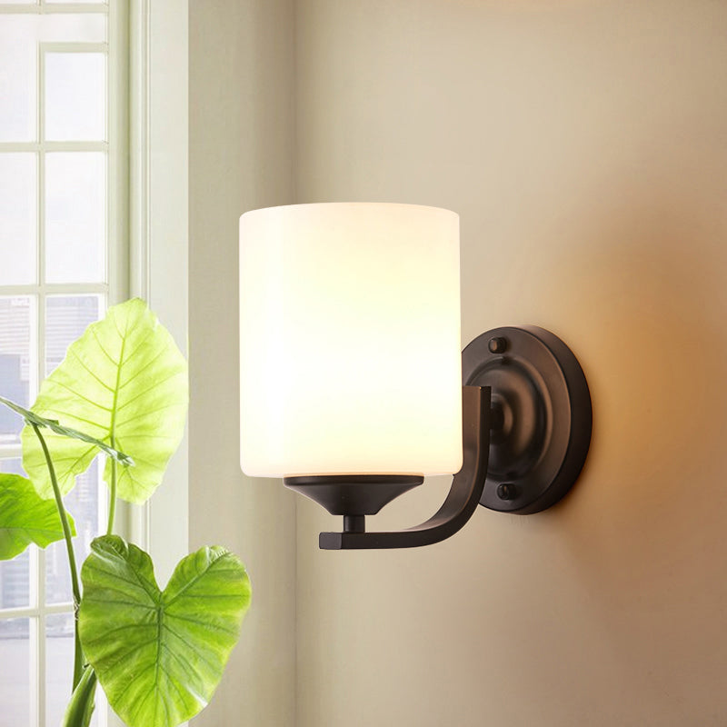 Single-Bulb Wall Sconce Simplicity Cylinder White Glass Wall Light Fixture in Black