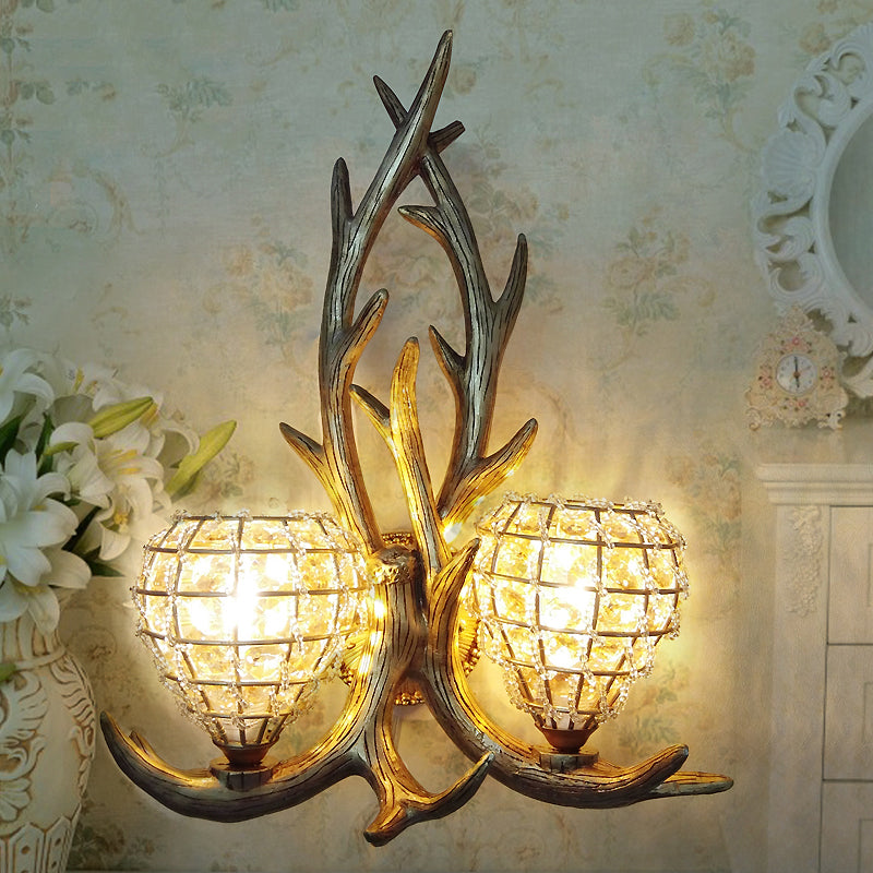 Resin Antler Wall Lighting Country 2-Light Bedroom Sconce Light Fixture in Brown/Gold with Globe Crystal Shade
